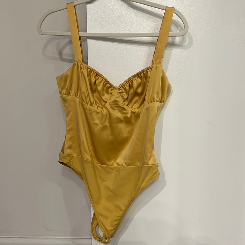 DB yellow gold color bodysuit